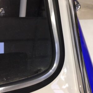 Rear window rubber with insert